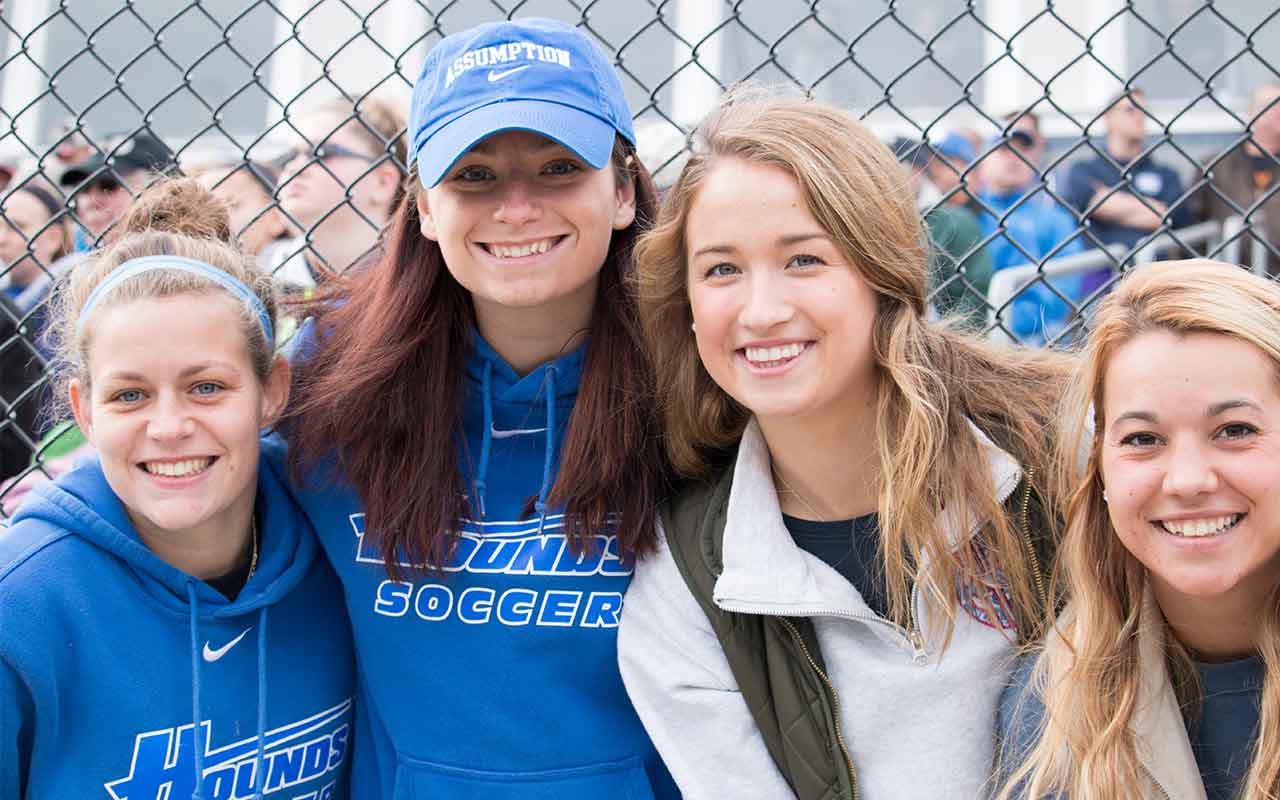 Assumption alumni enjoy the festivities of Homecoming.