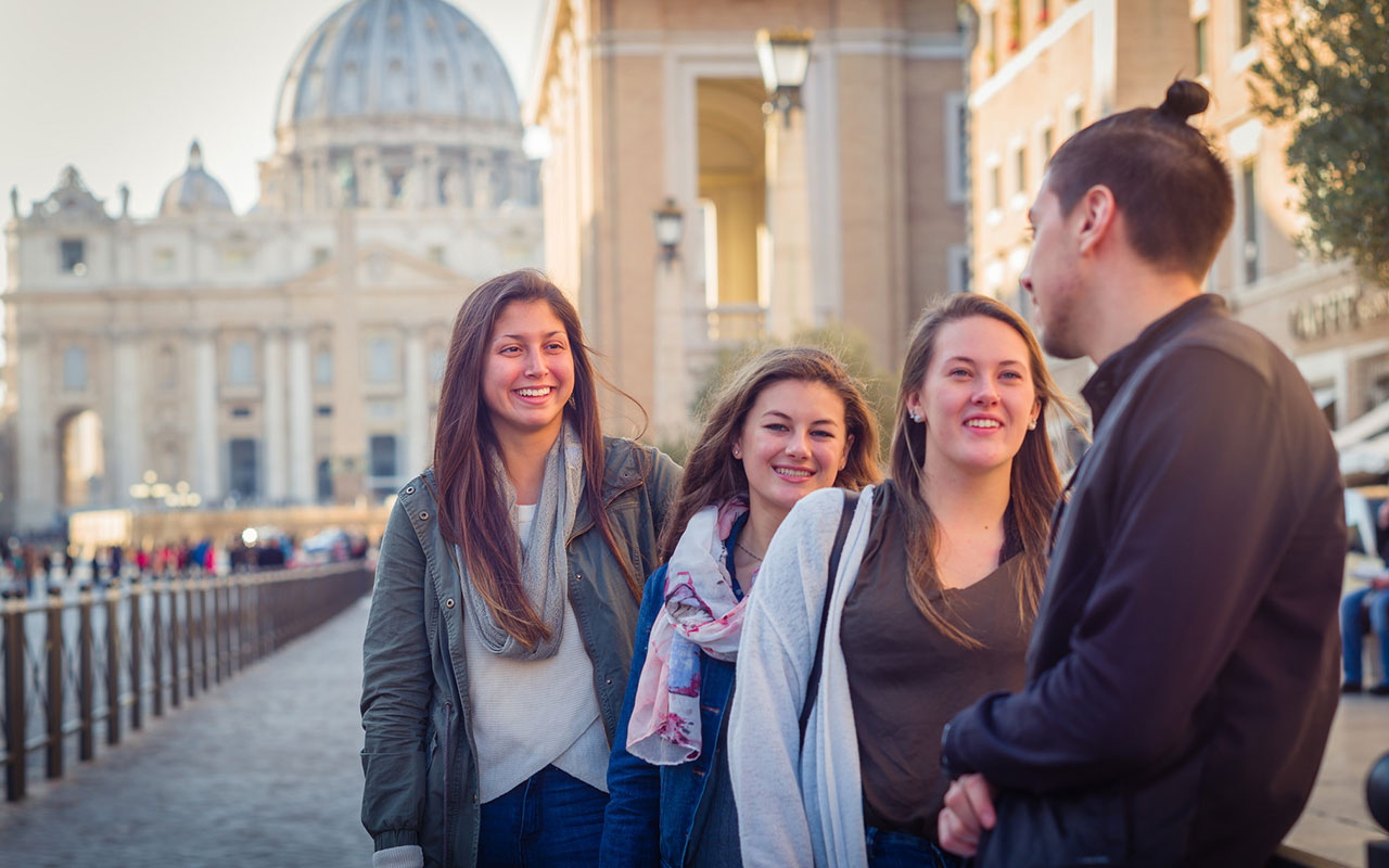 Assumption students studying at the College's campus in Rome, Italy pause outside of St. Peter's Basilica. 