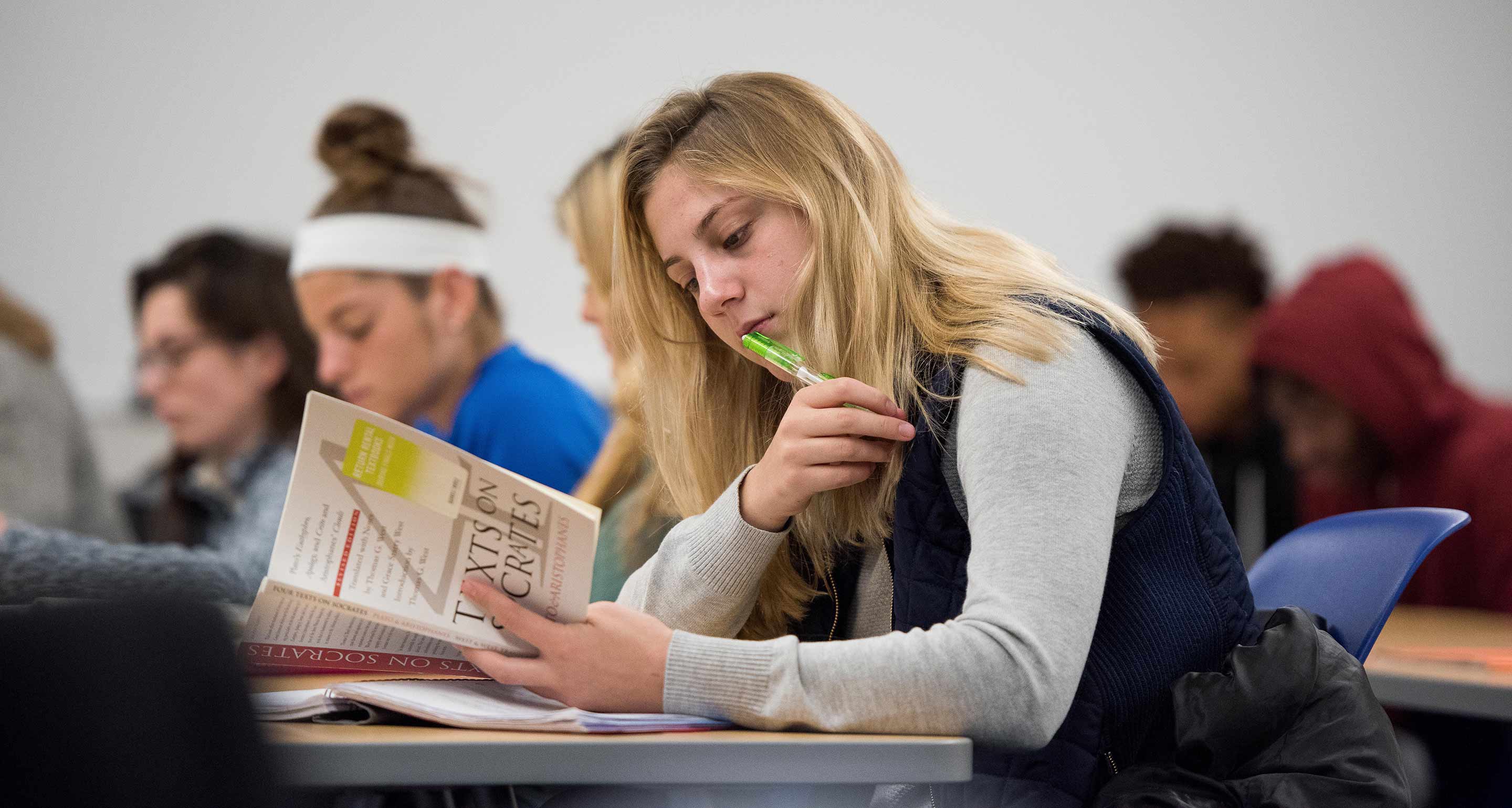 student reading book