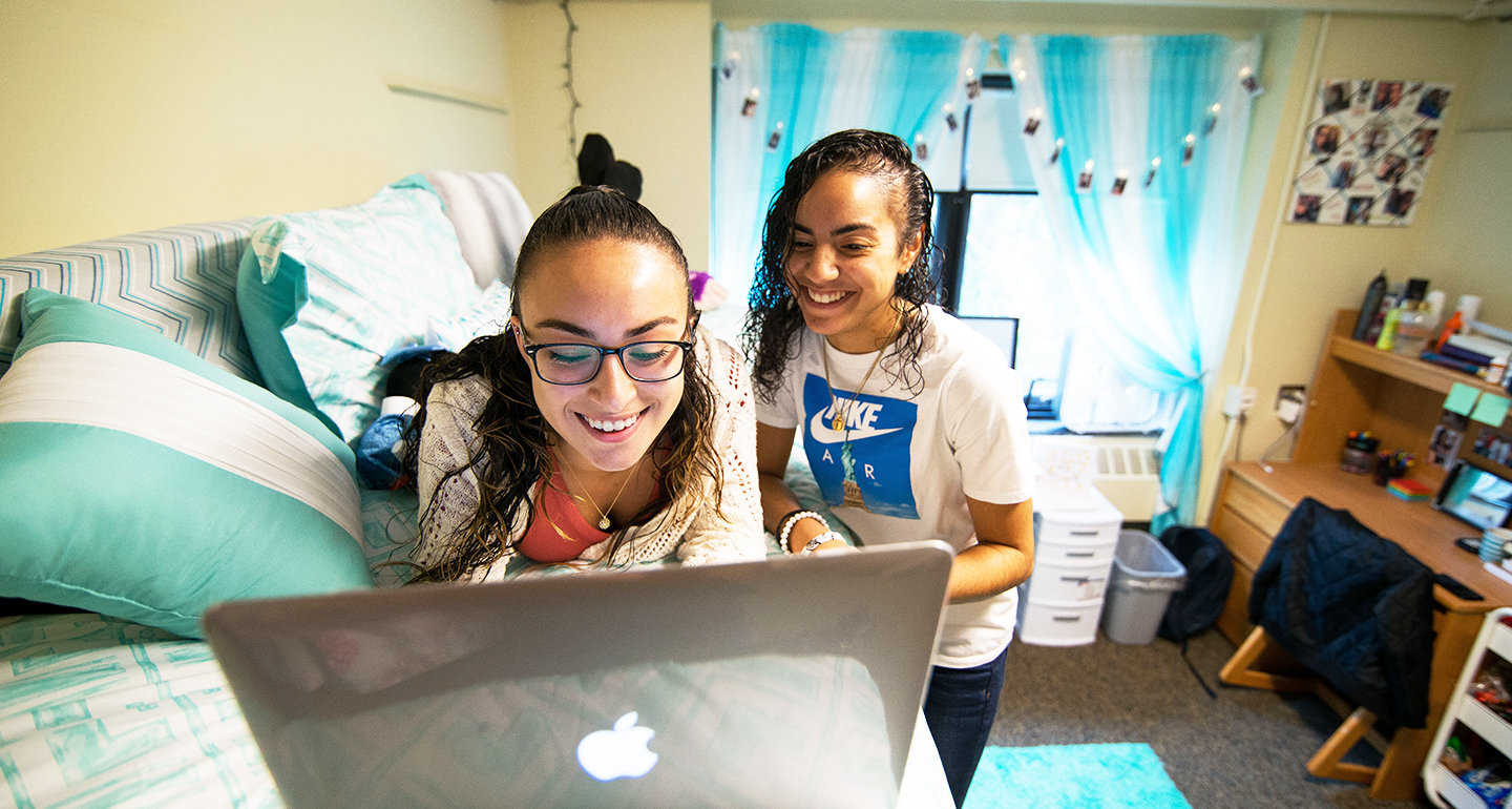 Assumption students studying in their dorm.