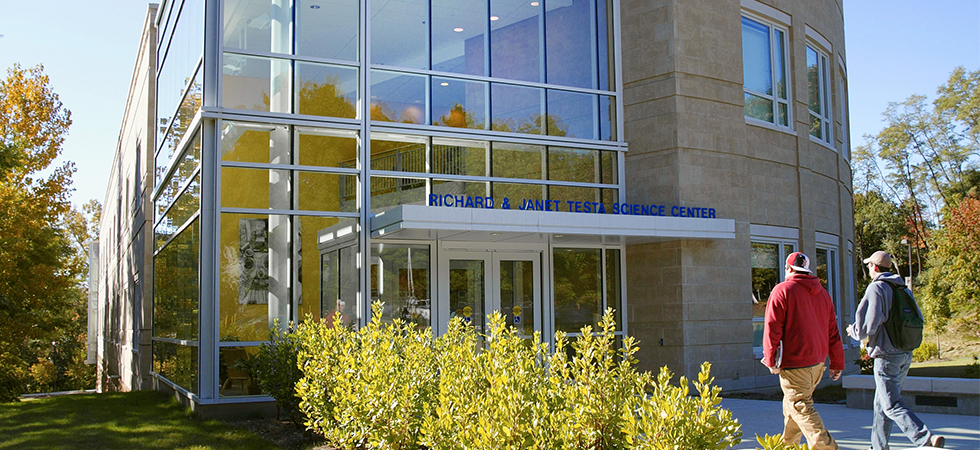 Assumption students walking into the Testa Science Center