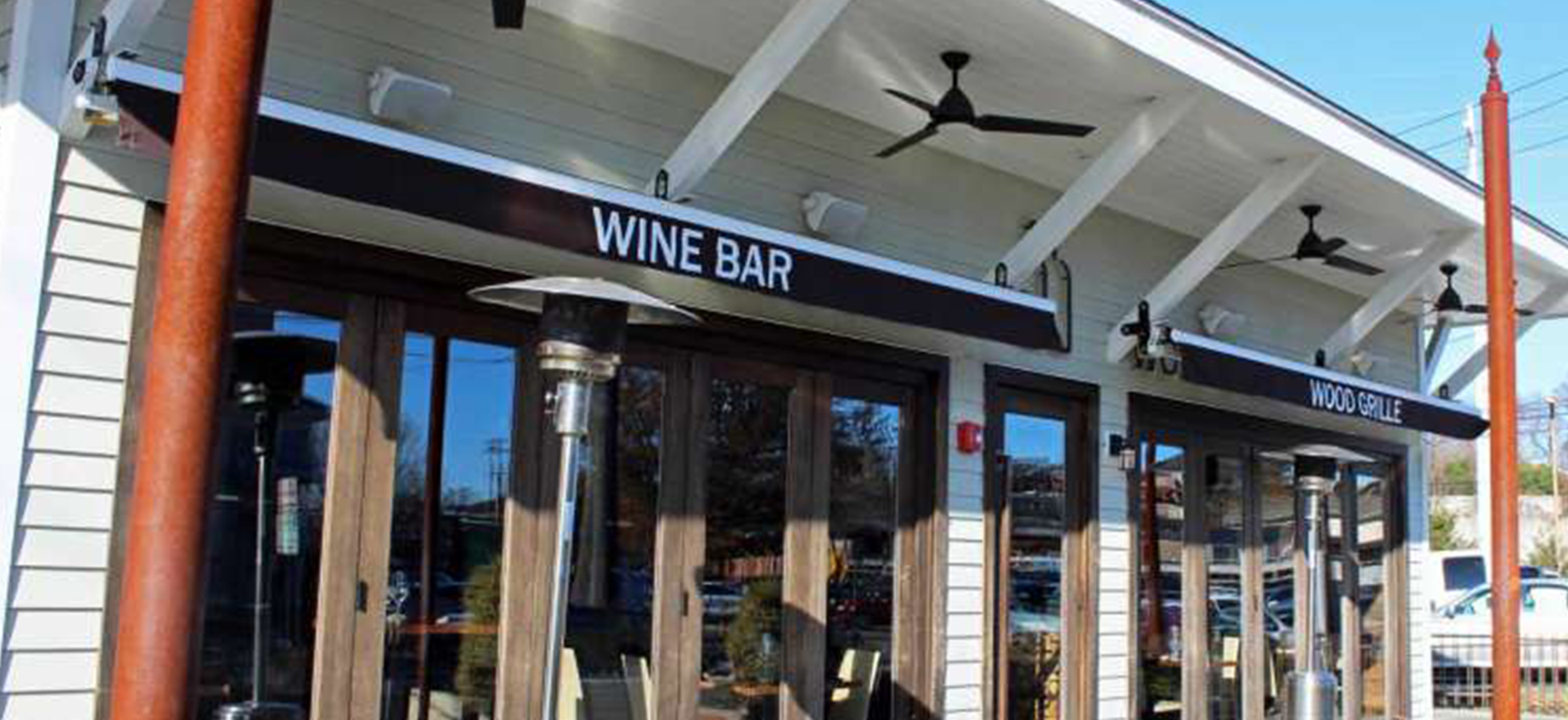 Exterior photo of the 55 Wine Bar, location of the March 26 Assumption College Alumni Meet-up/
