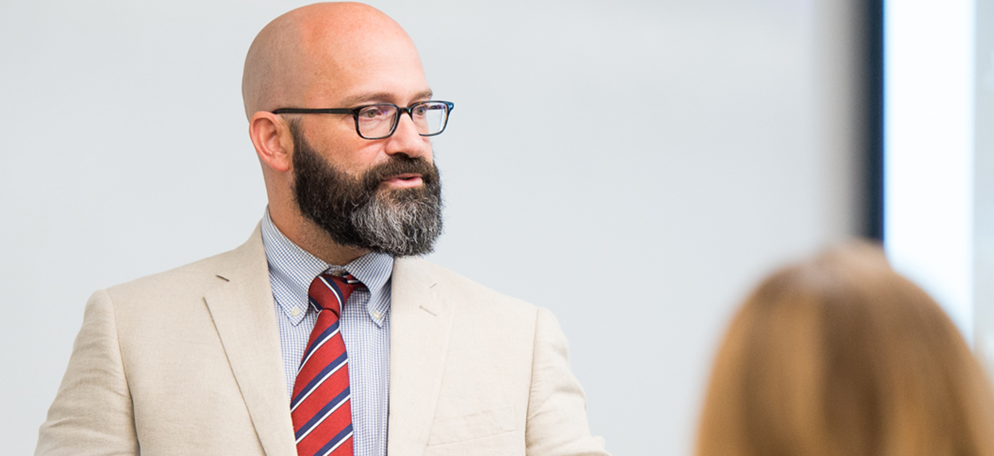 Assumption University Professor B.J. Dobski teaching in a classroom.
