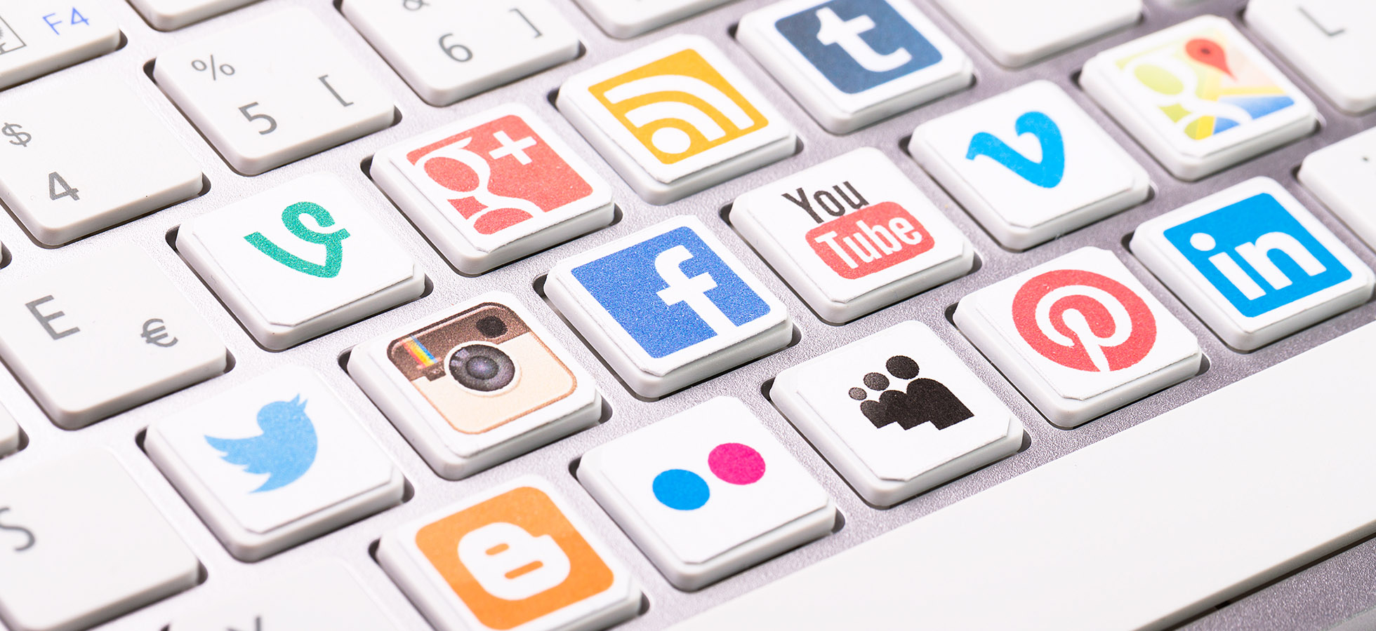 An Apple keyboard that has social media icons instead of letters.