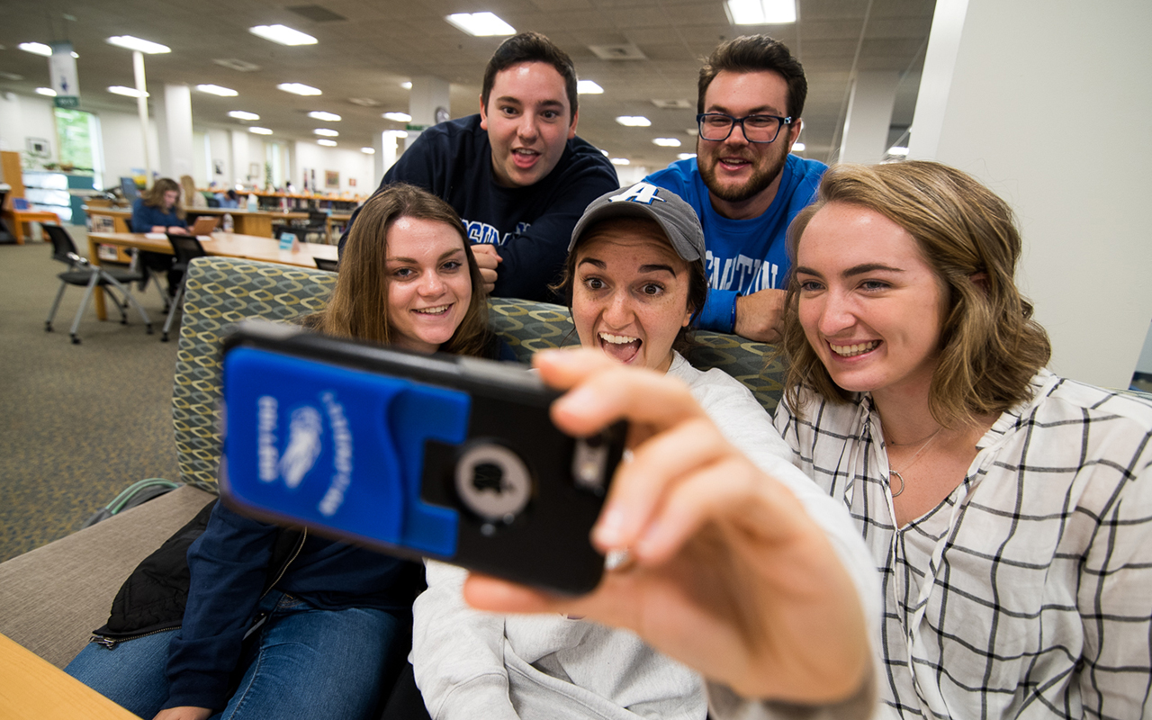 Assumption University students enjoy a study break in the d'Alzon Library.