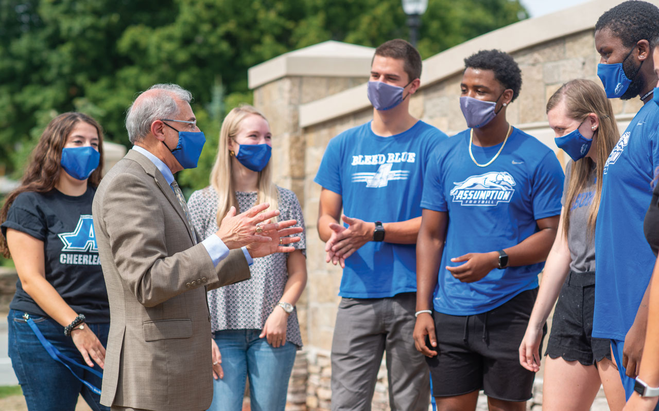 President Cesareo with students outside