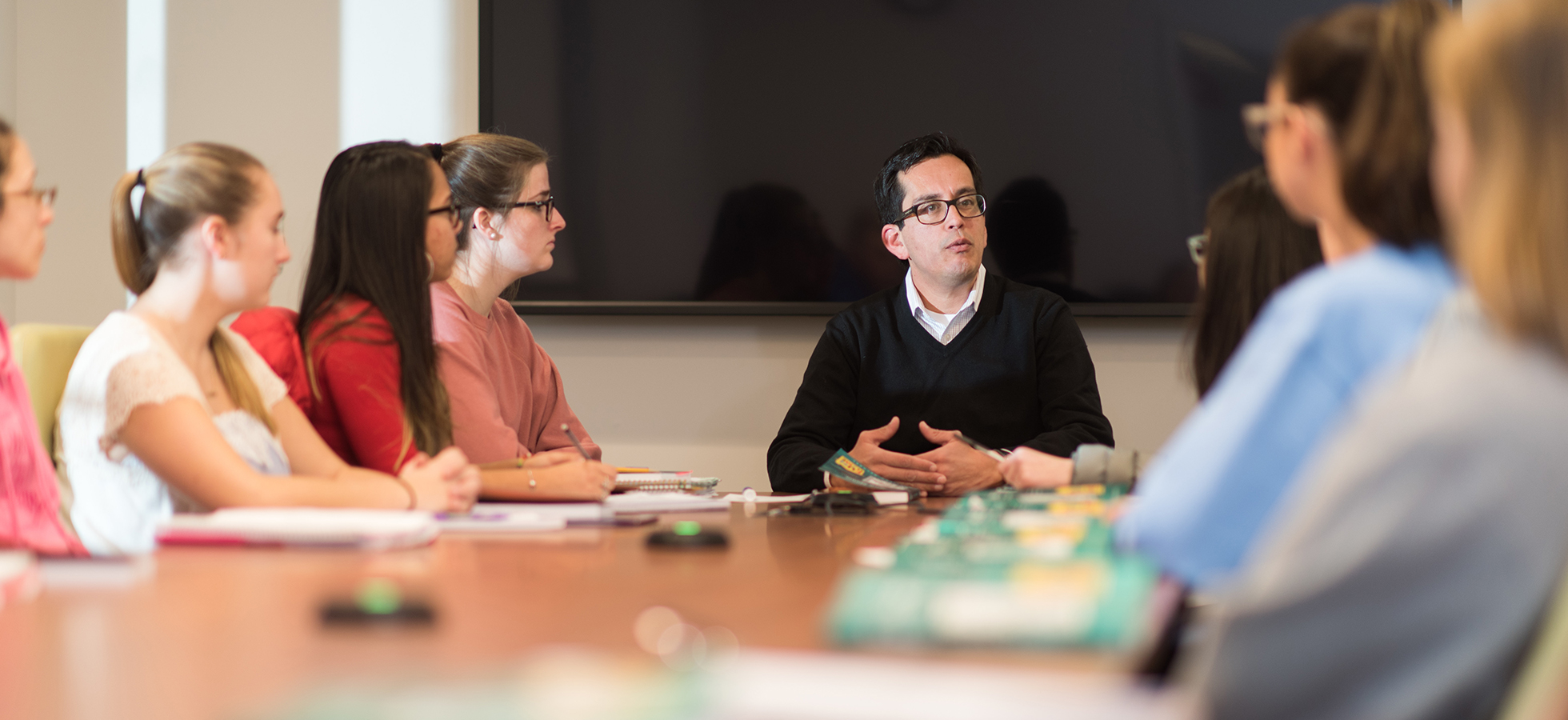 Esteban Loustaunau, Ph.D., Director of Assumption University's Center for Purpose and Vocation discusses with students the exploration of vocation in its many forms — active, contemplative, creative, religious, social, communal, personal, and professional.