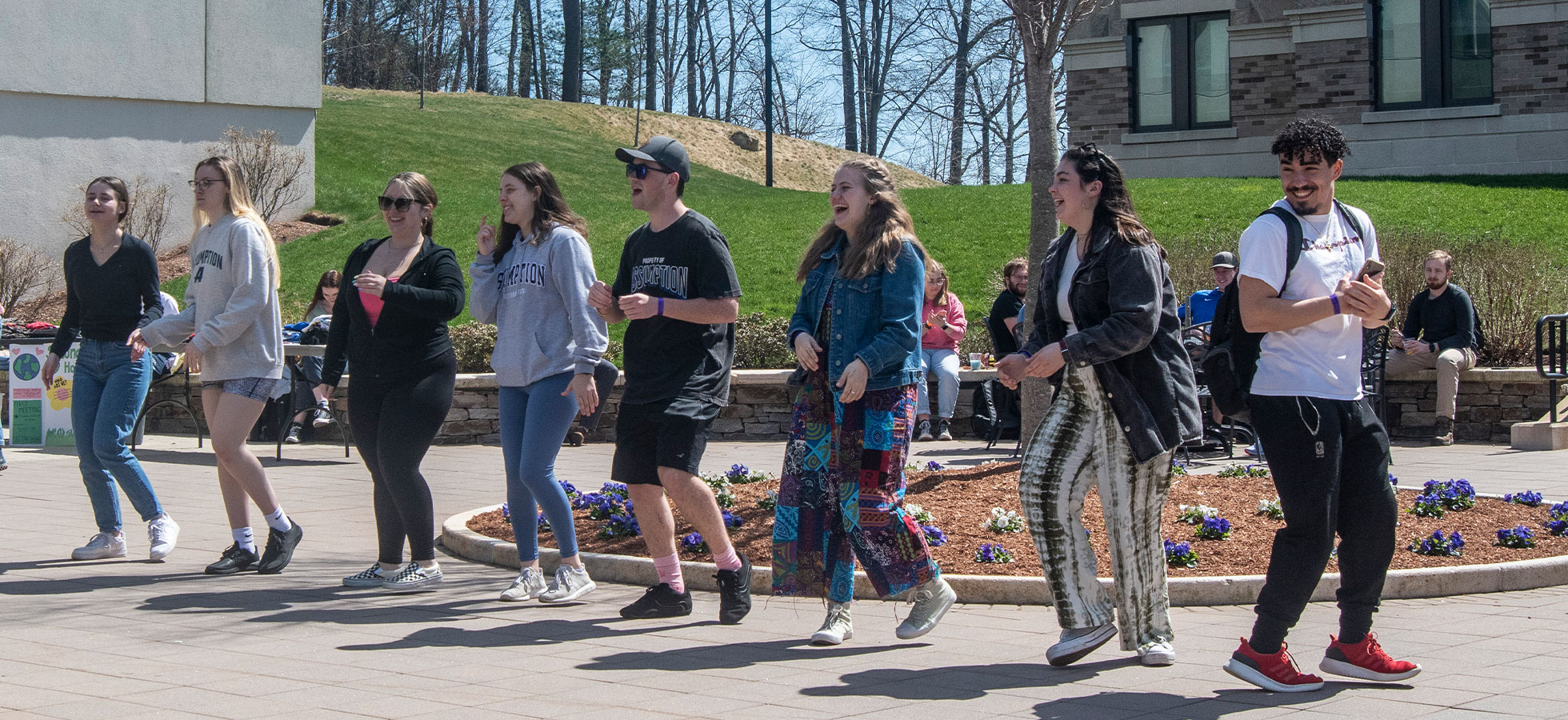 Assumption University students in Worcester, Massachusetts celebrating Earth Day by dancing.