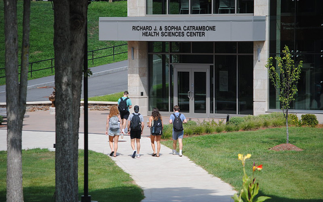Students walking in front of Catrambone building on campus