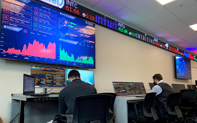 Students in the Lagarce Trading Room on campus