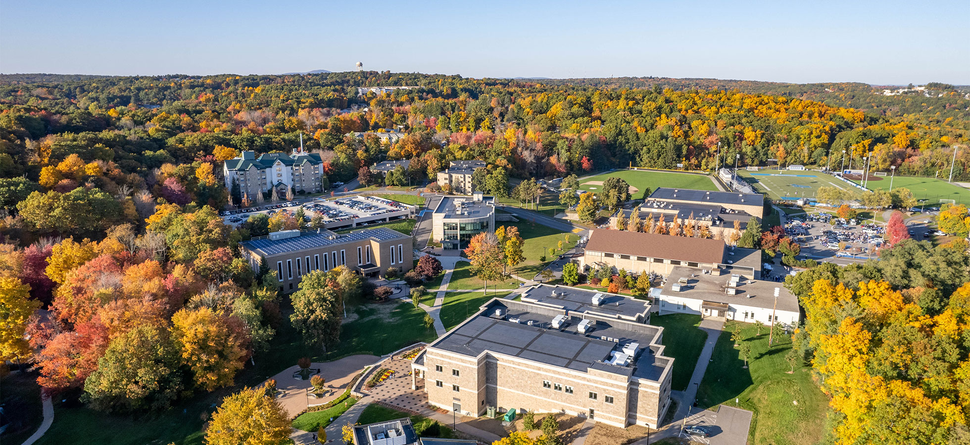 A photo of the campus of Assumption University taken from a drone is shown.