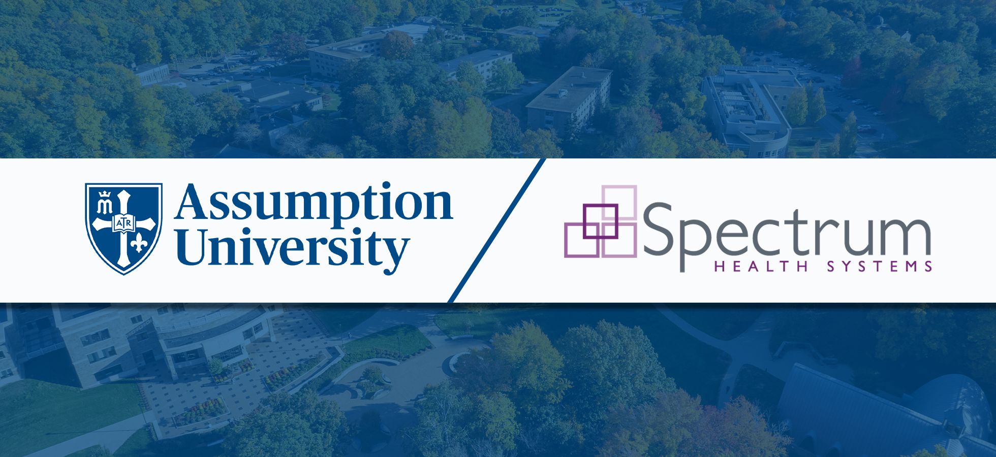 A photo shows the logos of both Assumption University and Spectrum Health Systems with the university in the background.
