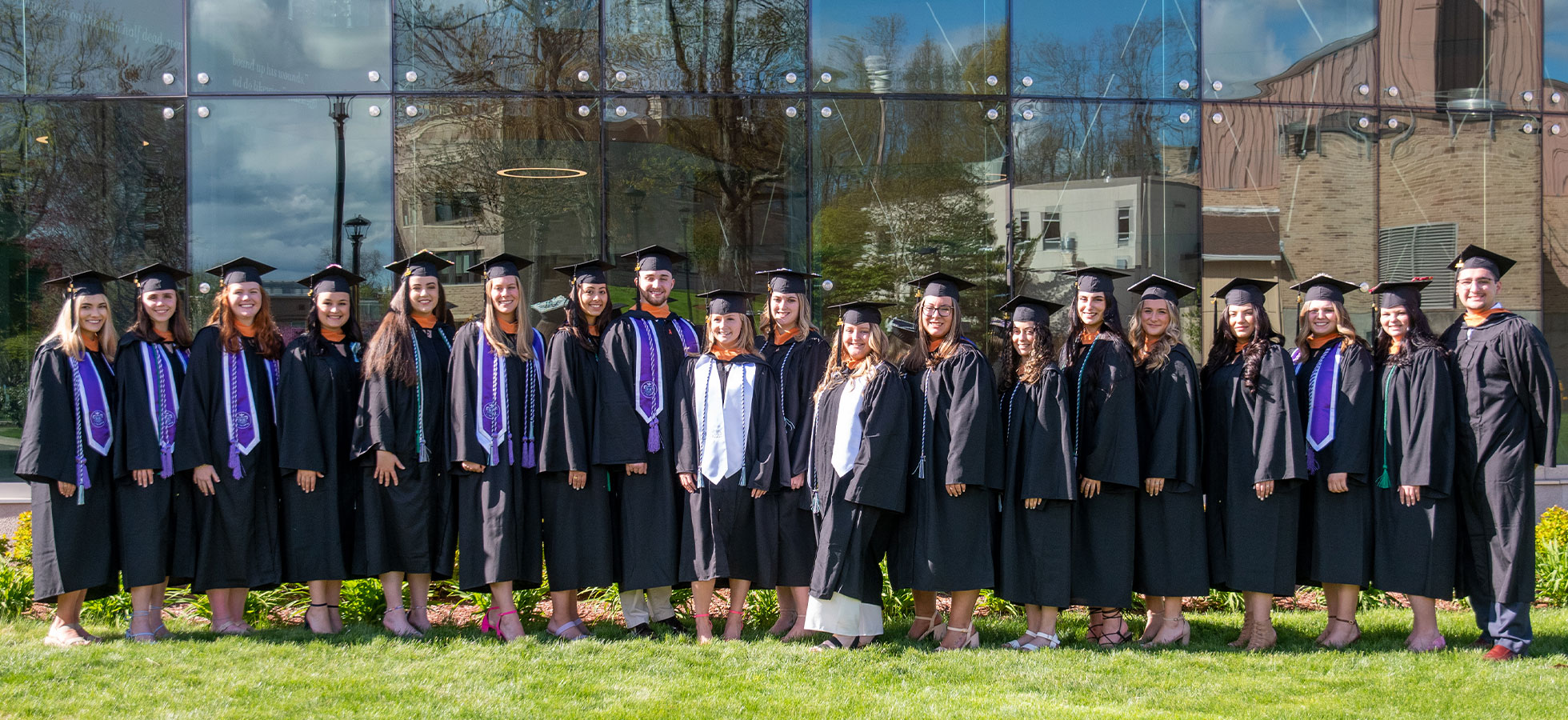 The students of the Froelich School of Nursing's Class of 2023 stand in front of the Catrambone Health Science Center.