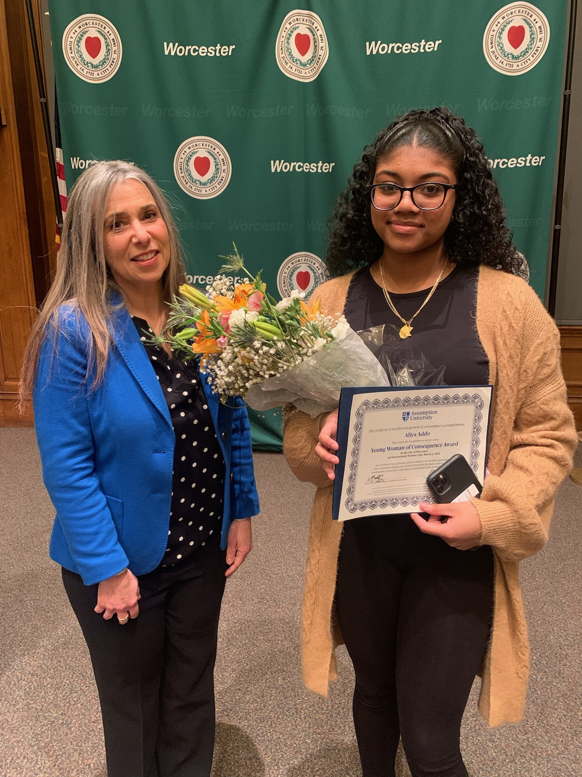 Assumption University Women's Studies Program director Cinzia Pica stands at the 2023 Worcester Woman of Consequence Awards Ceremony with award winner Aliya Addo