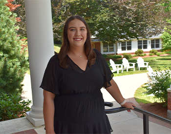 Photo of Isabella Valadas in front of the Admissions House