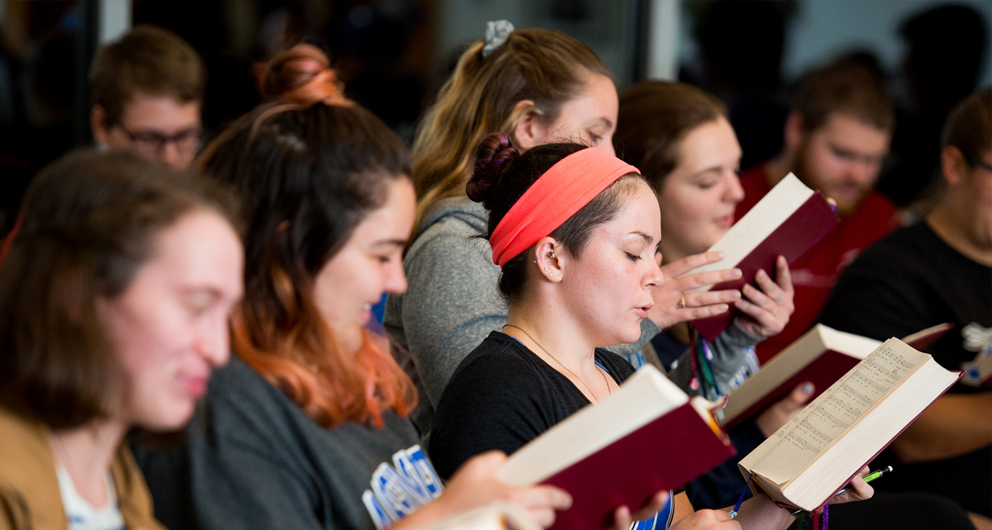Assumption students rehearse hymns that will be sung at Mass in the Chapel of the Holy Spirit.