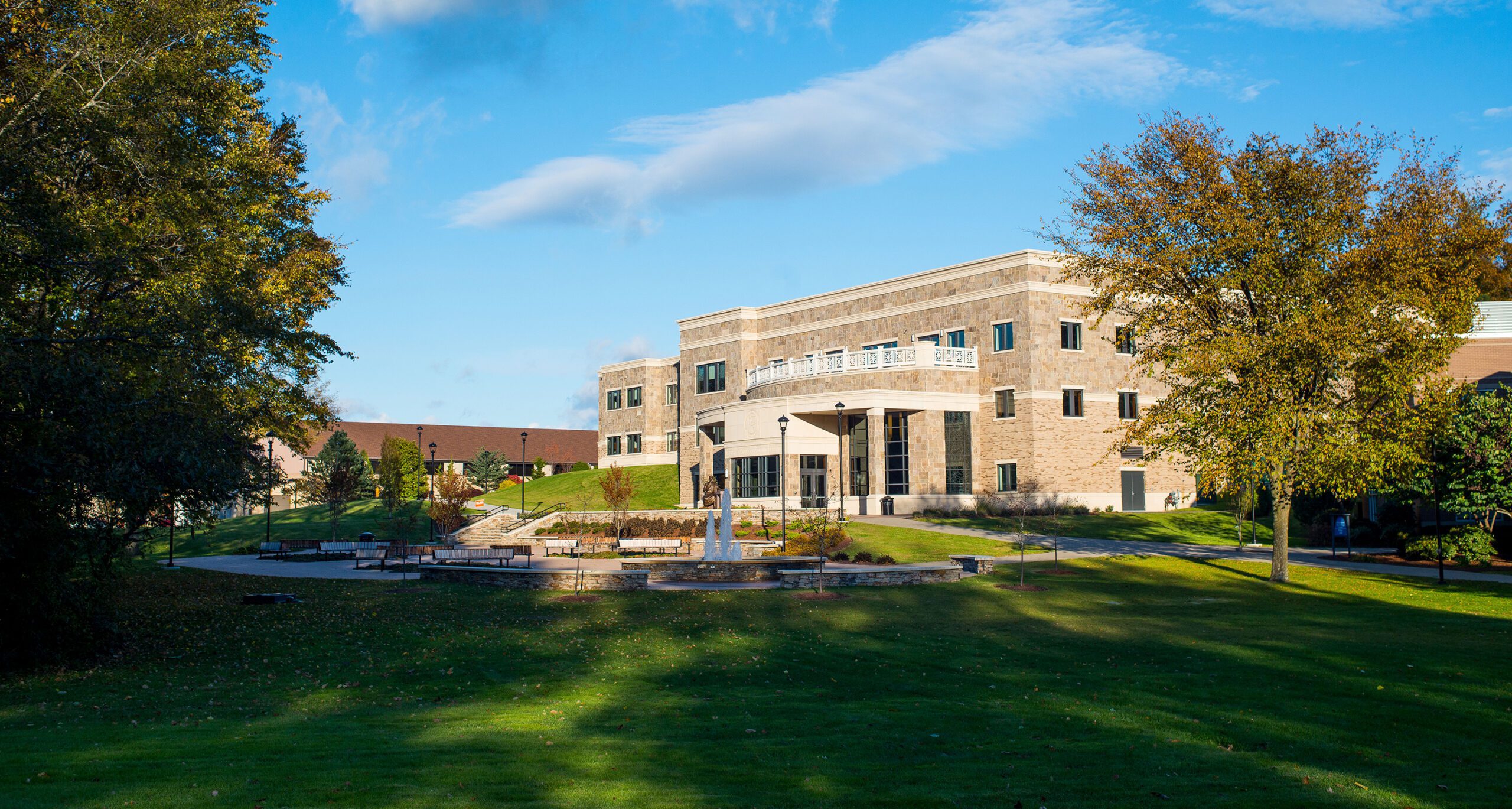 An exterior view of the Tsotsis Family Academic Center in early fall on the Assumption College campus.