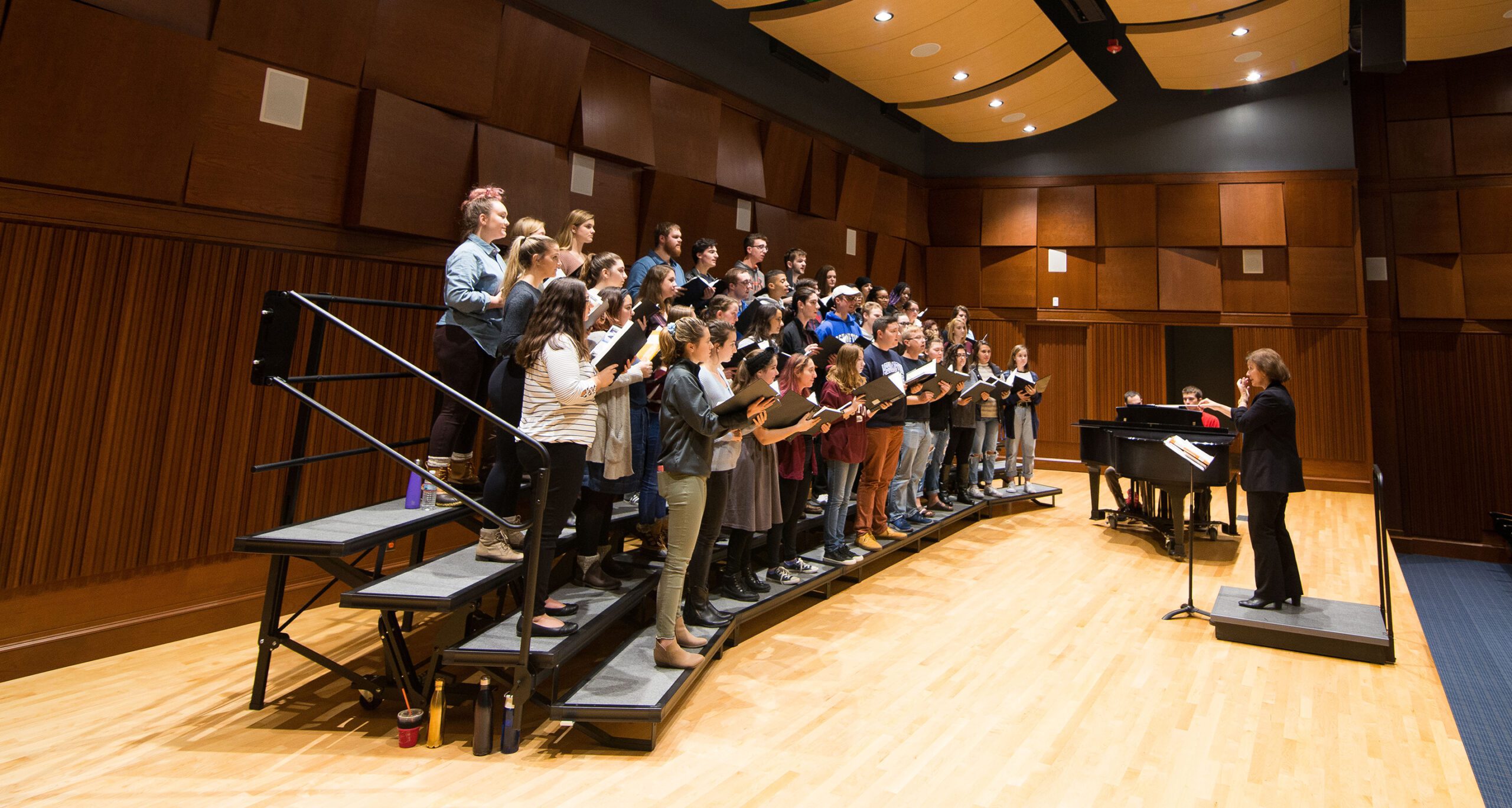 The Assumption College Chorale rehearses in the Jeanne Y. Curtis Auditorium.