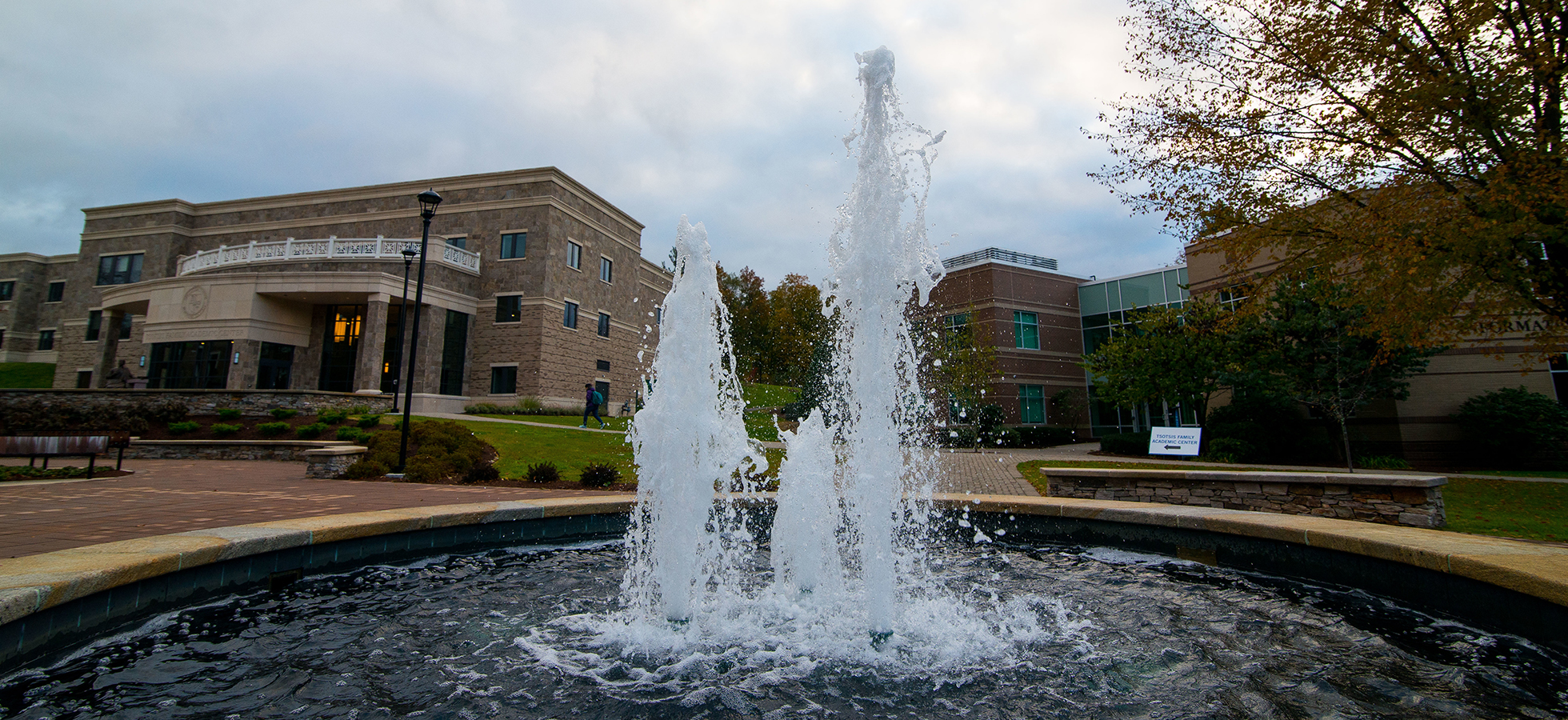 Photo of the exterior of the Tsotsis Family Academic Center with fountain.