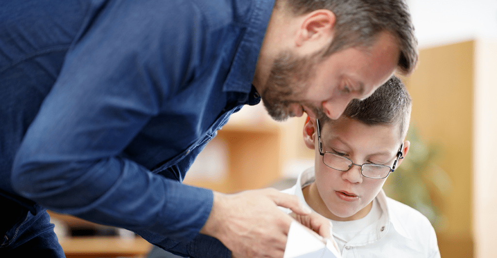 special ed teacher with young student