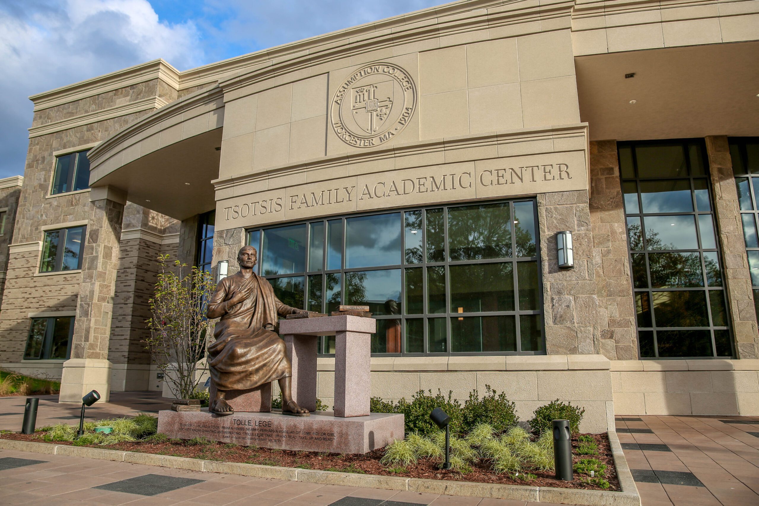 Front of the Tsotsis Family Academic Center building with the statue of St. Augustine.