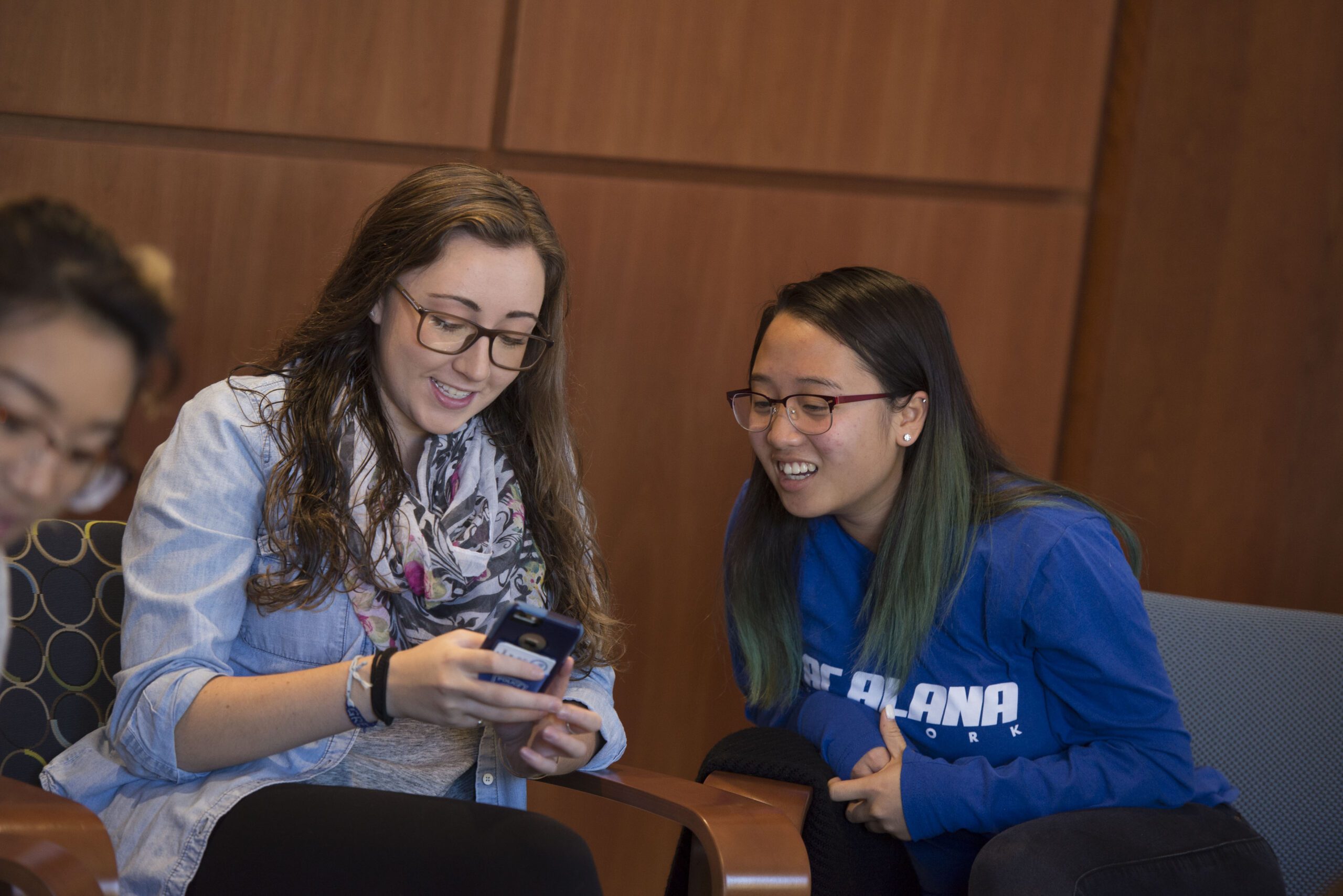 Two students sitting and chatting