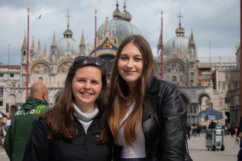 Two female students smiling in Rome.