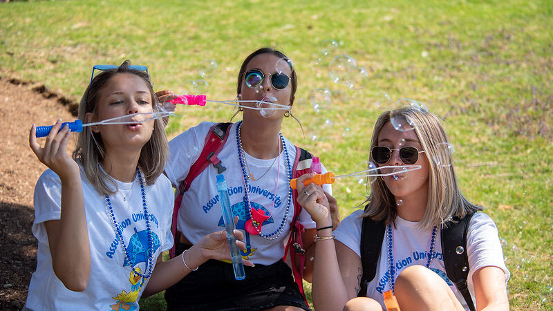 Group of students blowing bubbles.
