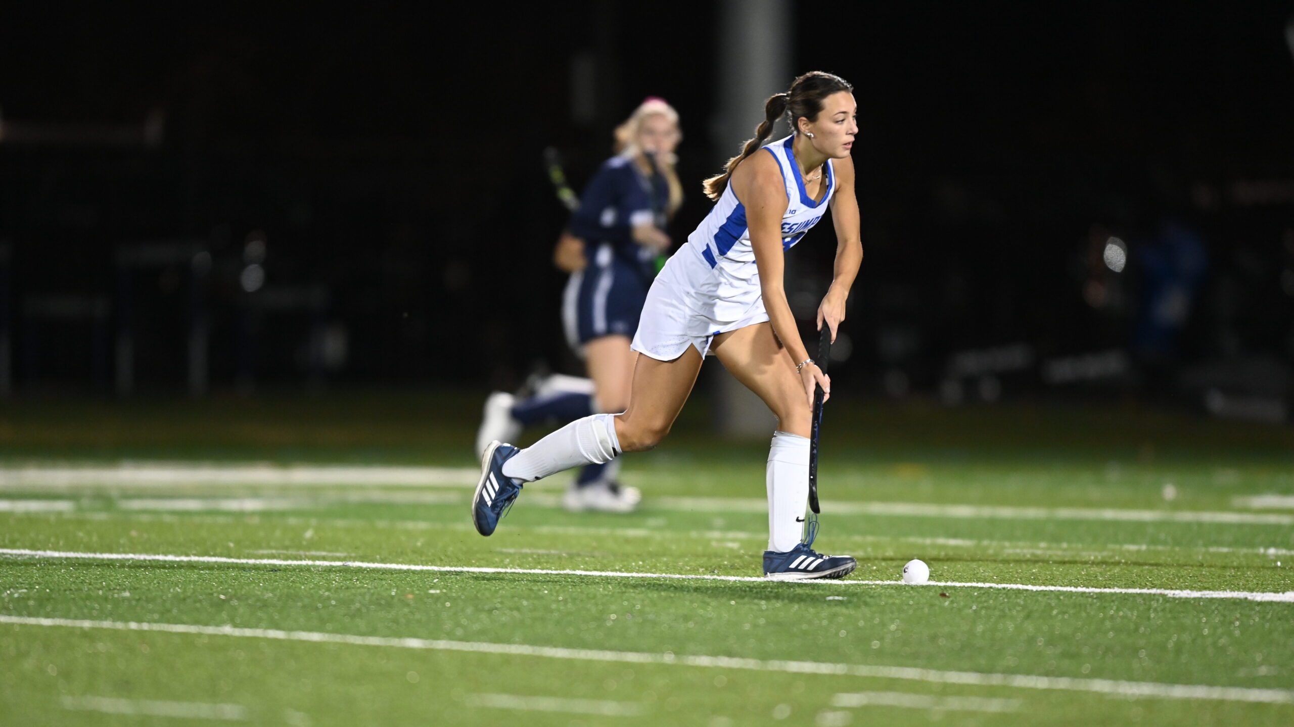 Assumption University student-athlete competes in a field hockey game