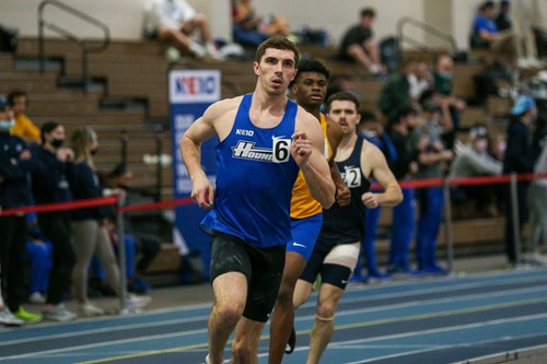 Assumption Greyhounds student-athlete Noah Laren running in a track meet