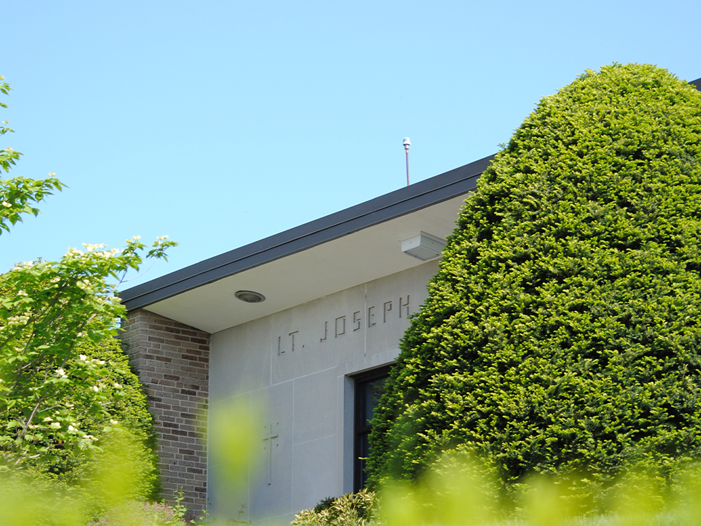 Image of an entrance to the Kennedy building on a nice sunny day.