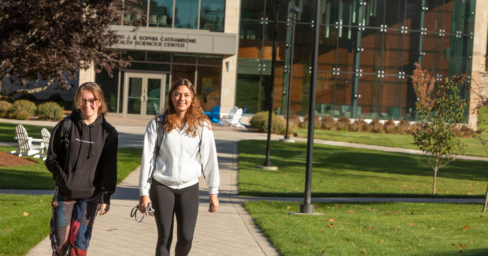 Students walking around campus on a beautiful sunny day