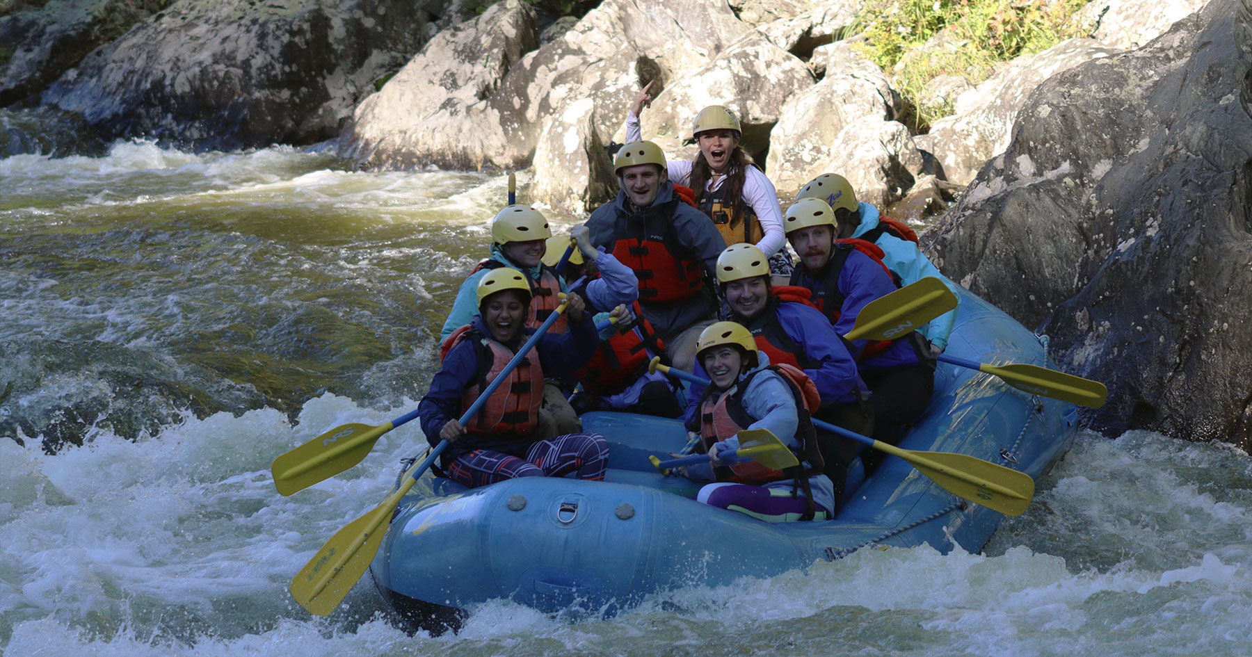 Outdoors club students participate in a white water rafting trip