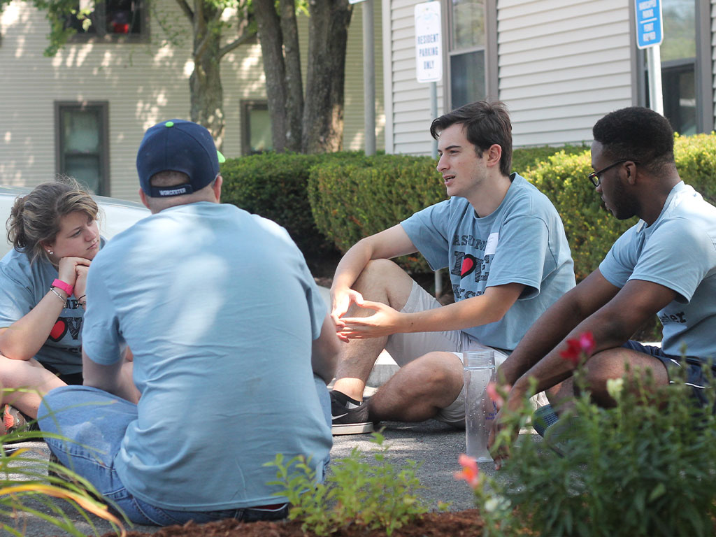 Assumption students doing community service