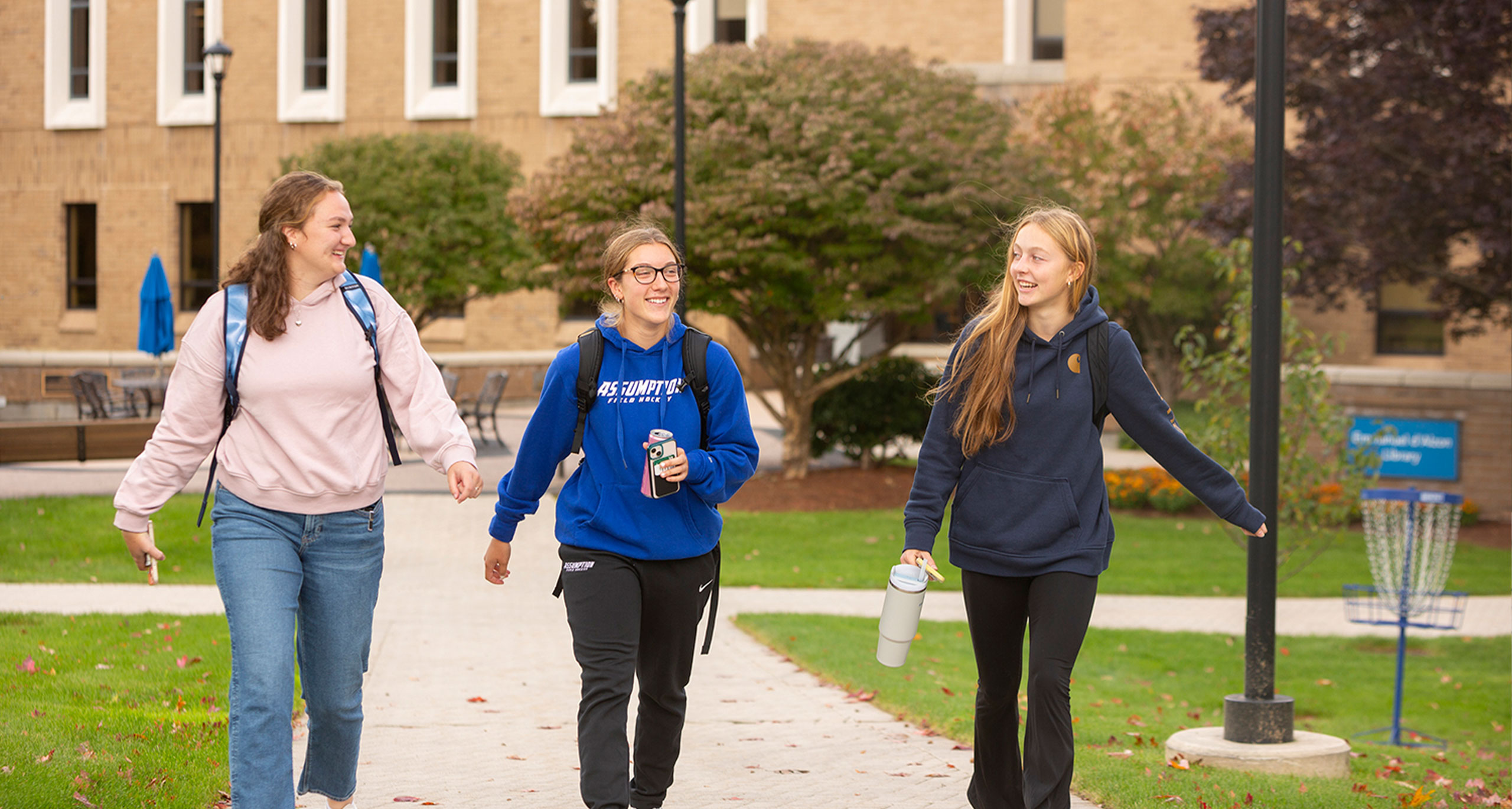 Assumption students walking on the upper quad of campus