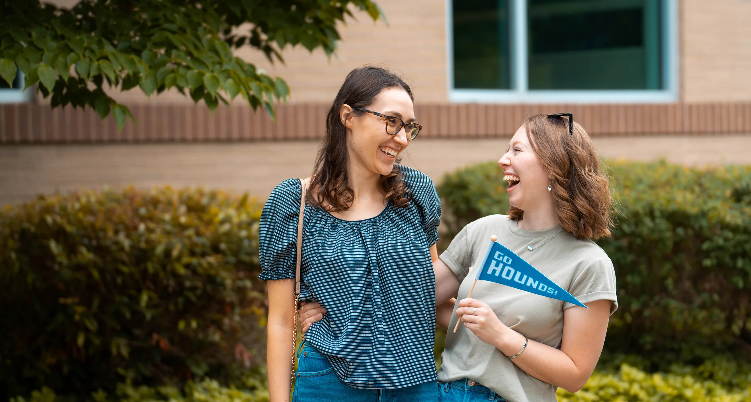 Assumption students holding a 