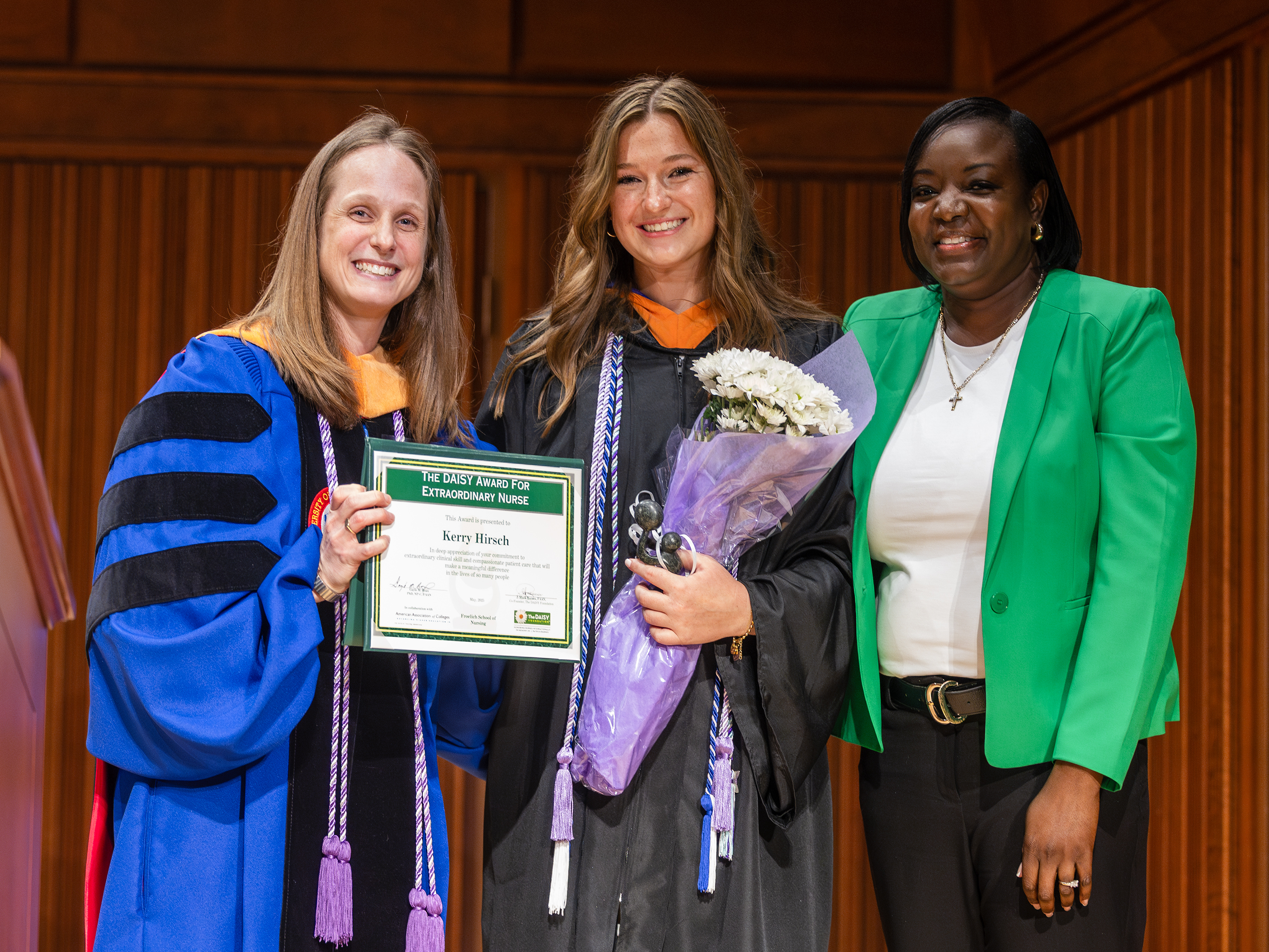 Kerry Hirsch receives an award at nursing pinning.