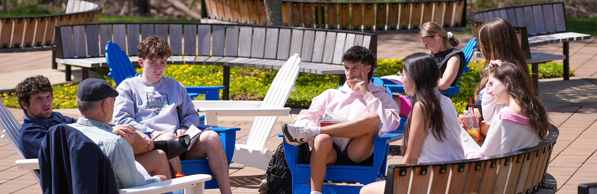 Faculty hosting a classroom outside at Assumption University