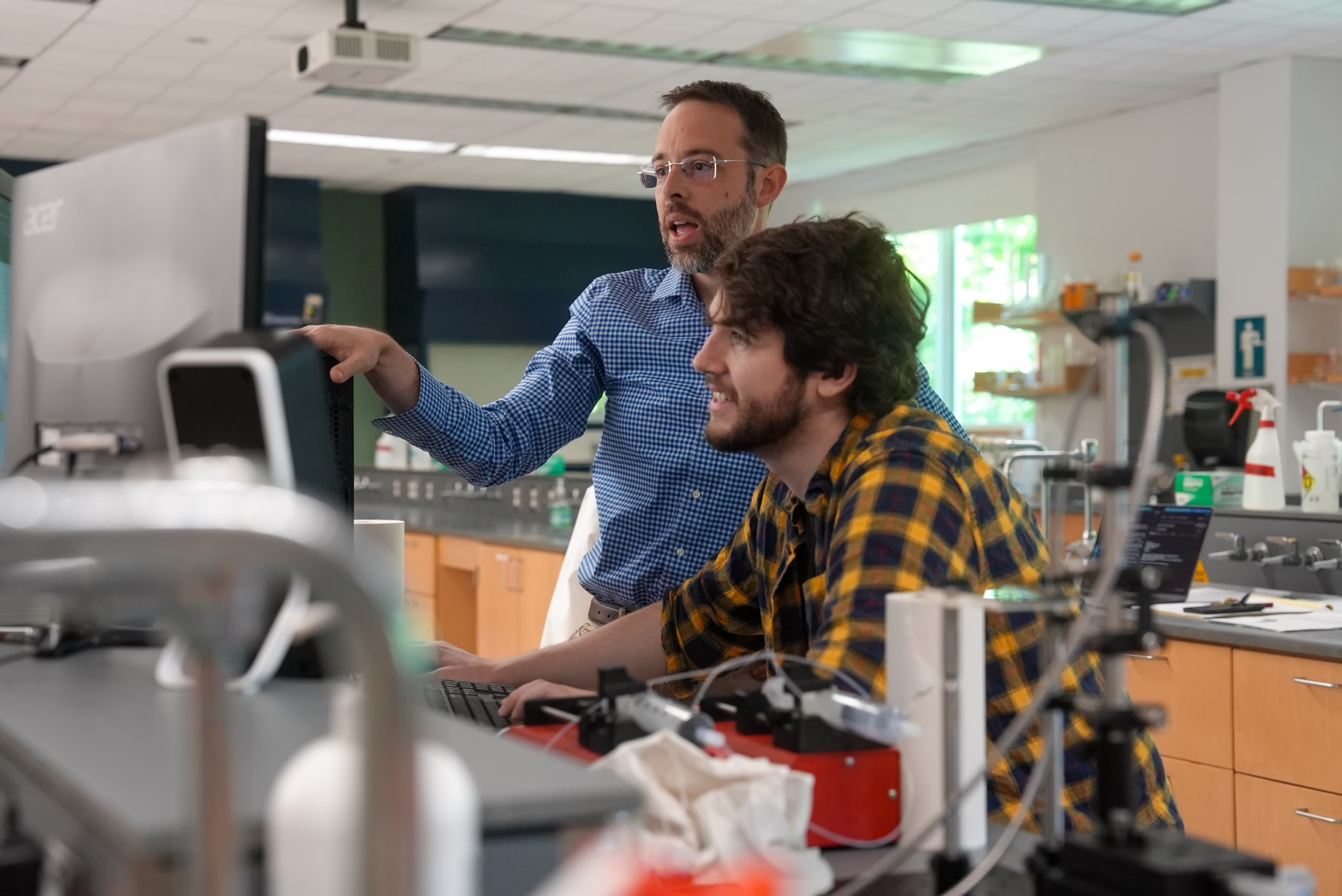 Professor Ben Knurr and Daniel Liberty work together on research.