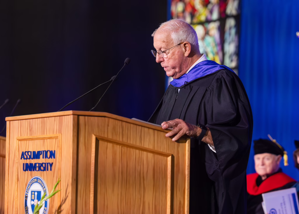 Larry Thayer speaks at Assumption's graduate commencement.