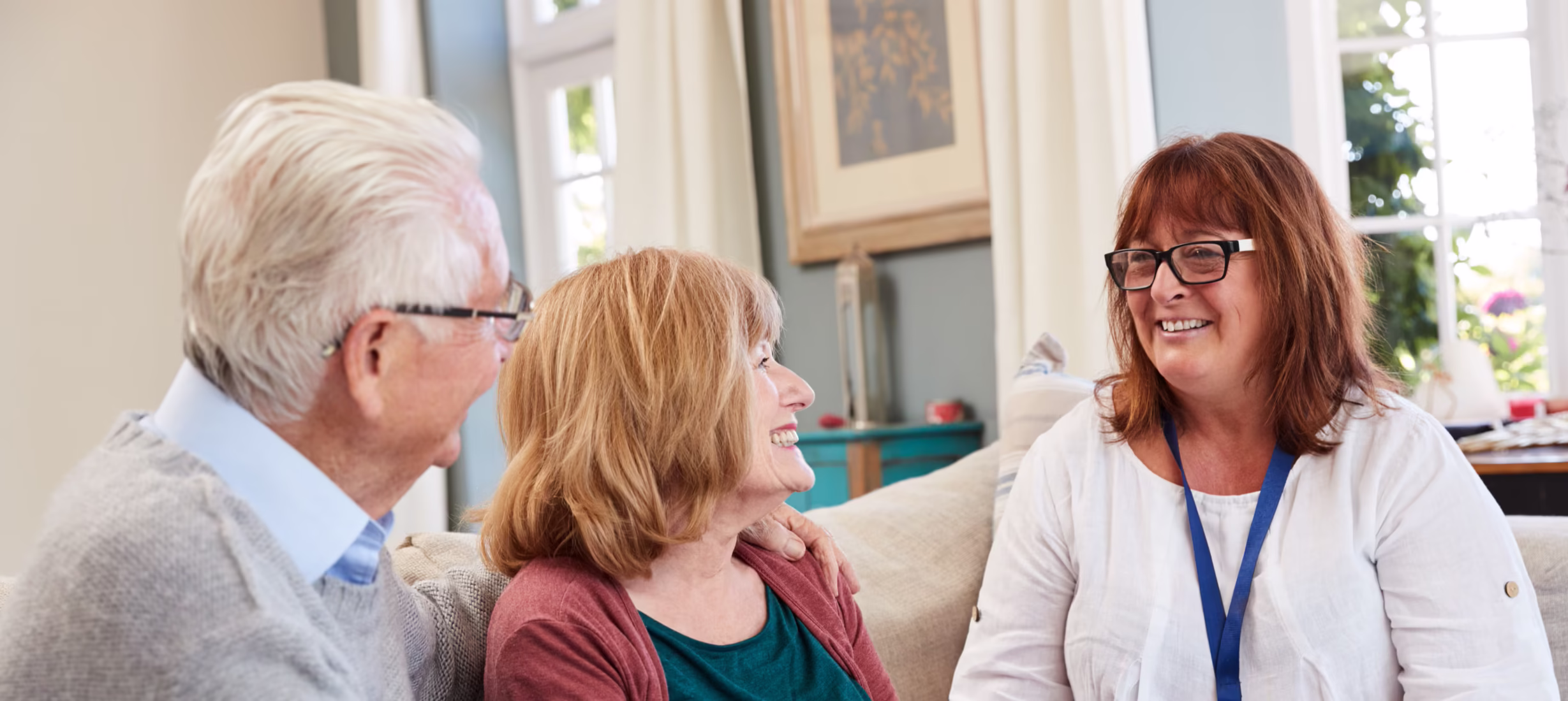 Social worker sitting with a couple