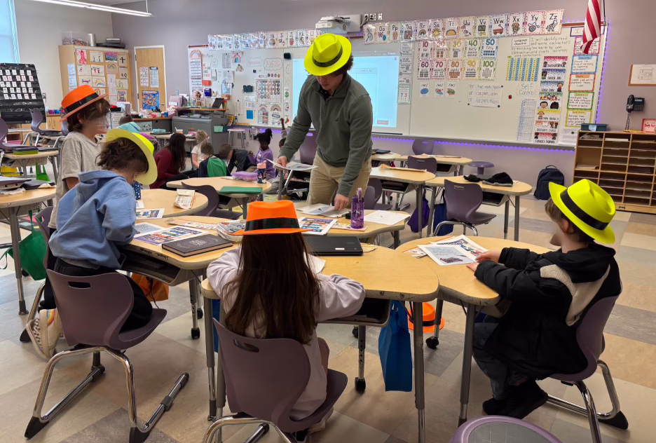 Domenic Simonelli works with Nelson Place elementary students