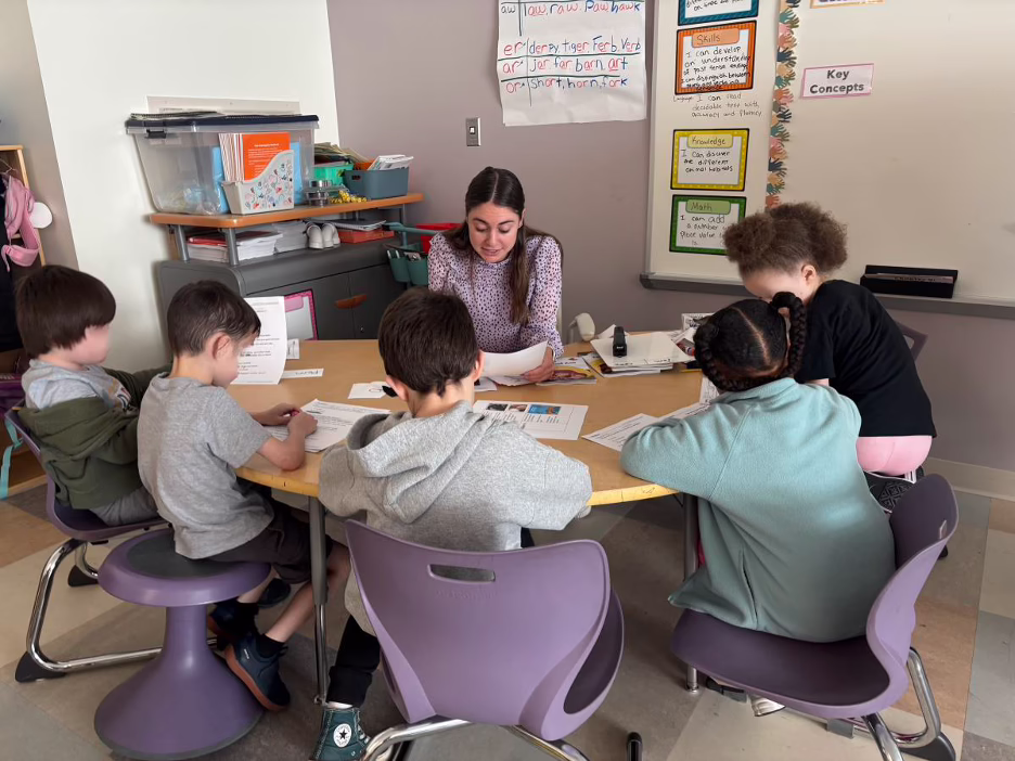 Emma Tremblay works with Nelson Place students.