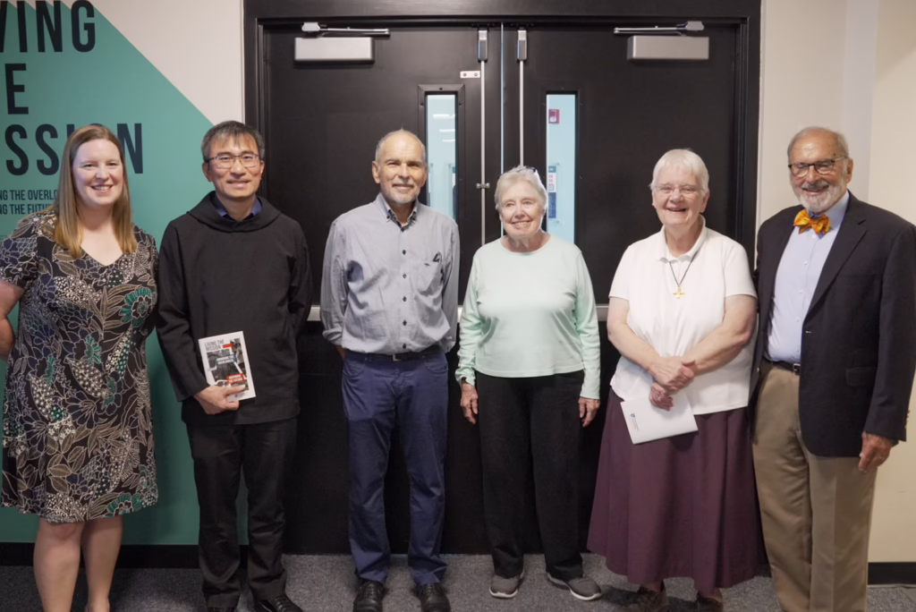 Important members of Assumption's community open the doors to the Living the Mission exhibit.